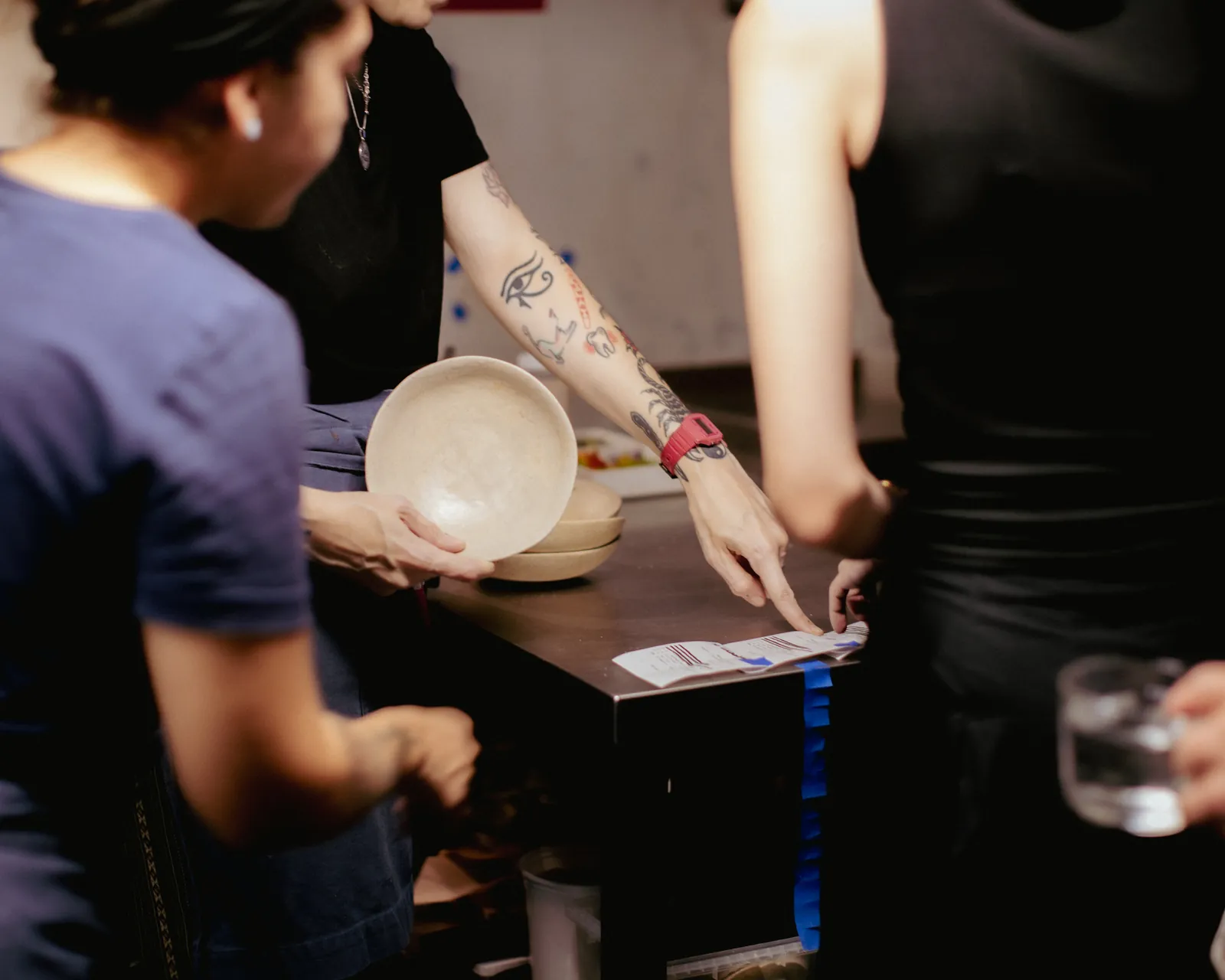 a plate handed across the pass, the docket beside it