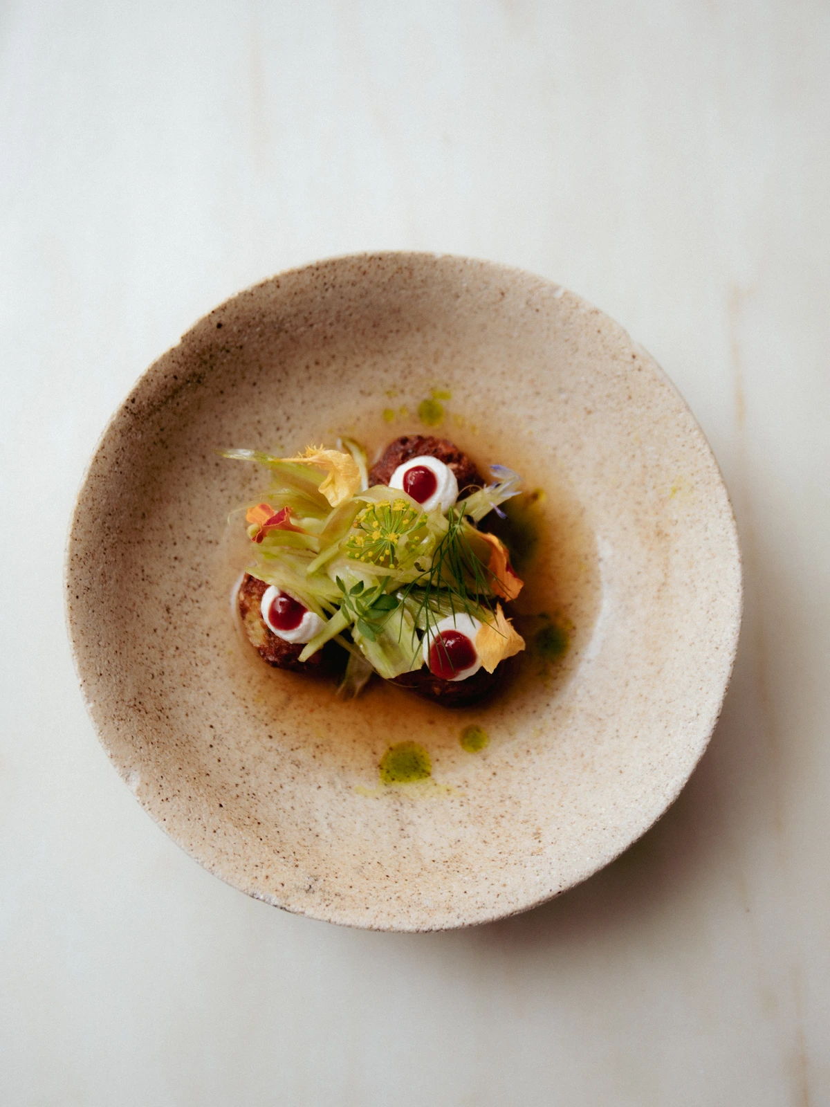 chickling vetch falafel · tomato water · black sesame