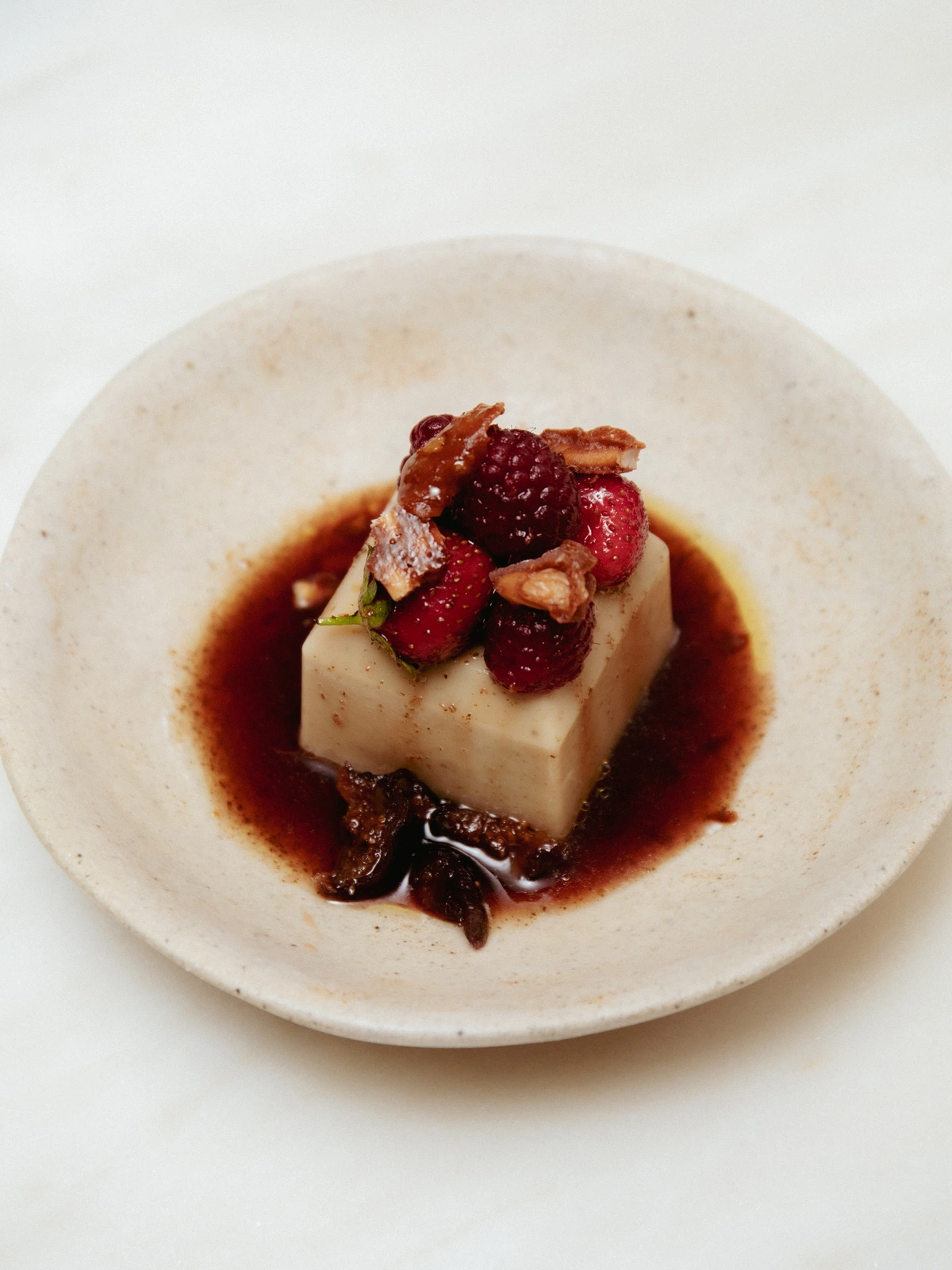 fig leaf panna cotta · poached fruit · pine nuts