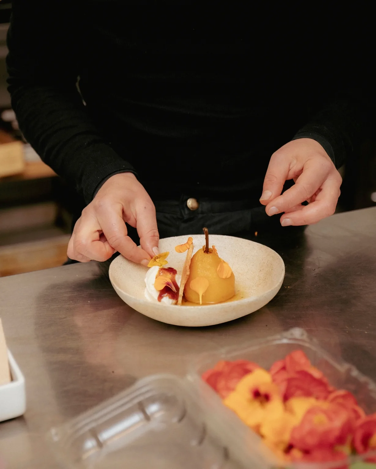 Monika plating a dish at VENN